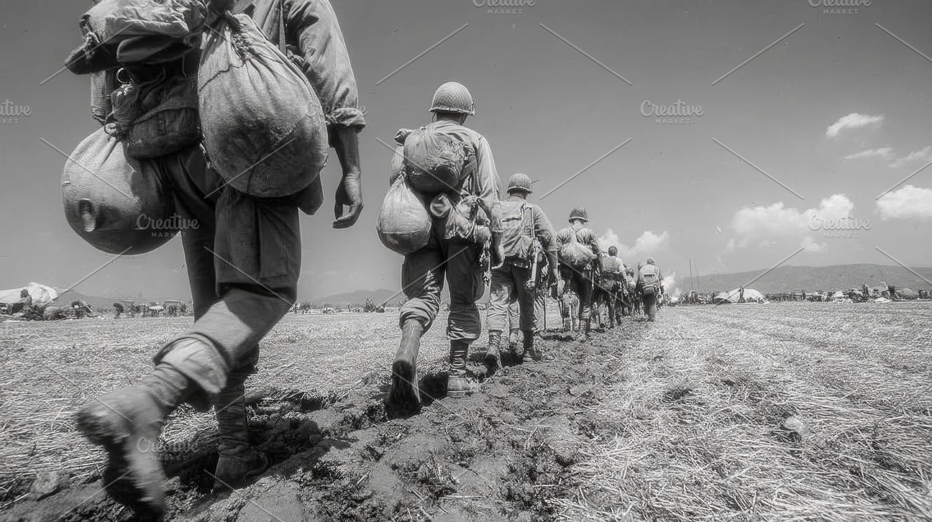 American soldiers marching across a muddy field during the Vietnam War carrying, a Photo by AS photostudio