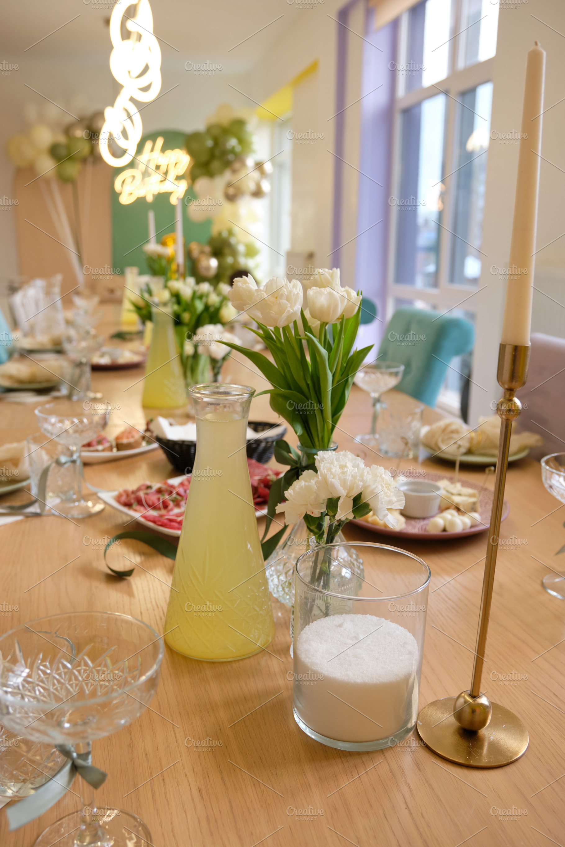 Festive birthday table setting with white tulips, golden candle holder and lemo, a Food & Drink Photo by Rohan Photography