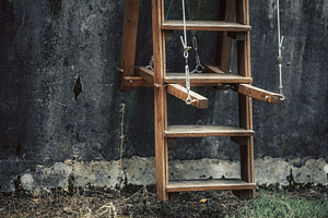 Hanging wooden ladder in yard, an Architecture Photo by SkyNext