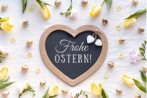 Heart-shaped chalkboard with Frohe, a Holiday Photo by tilialucida