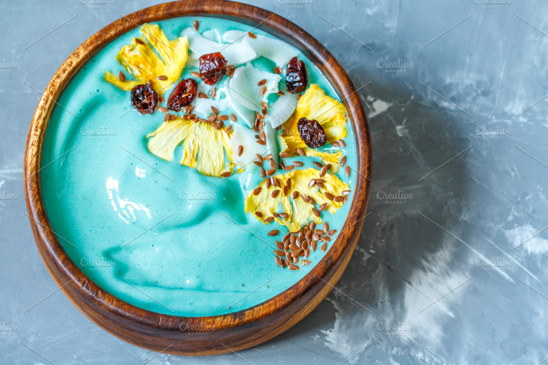 Blue spirulina smoothie bowl containing smoothie, chocolate, and blue, a Food & Drink Photo by vaaseenaa