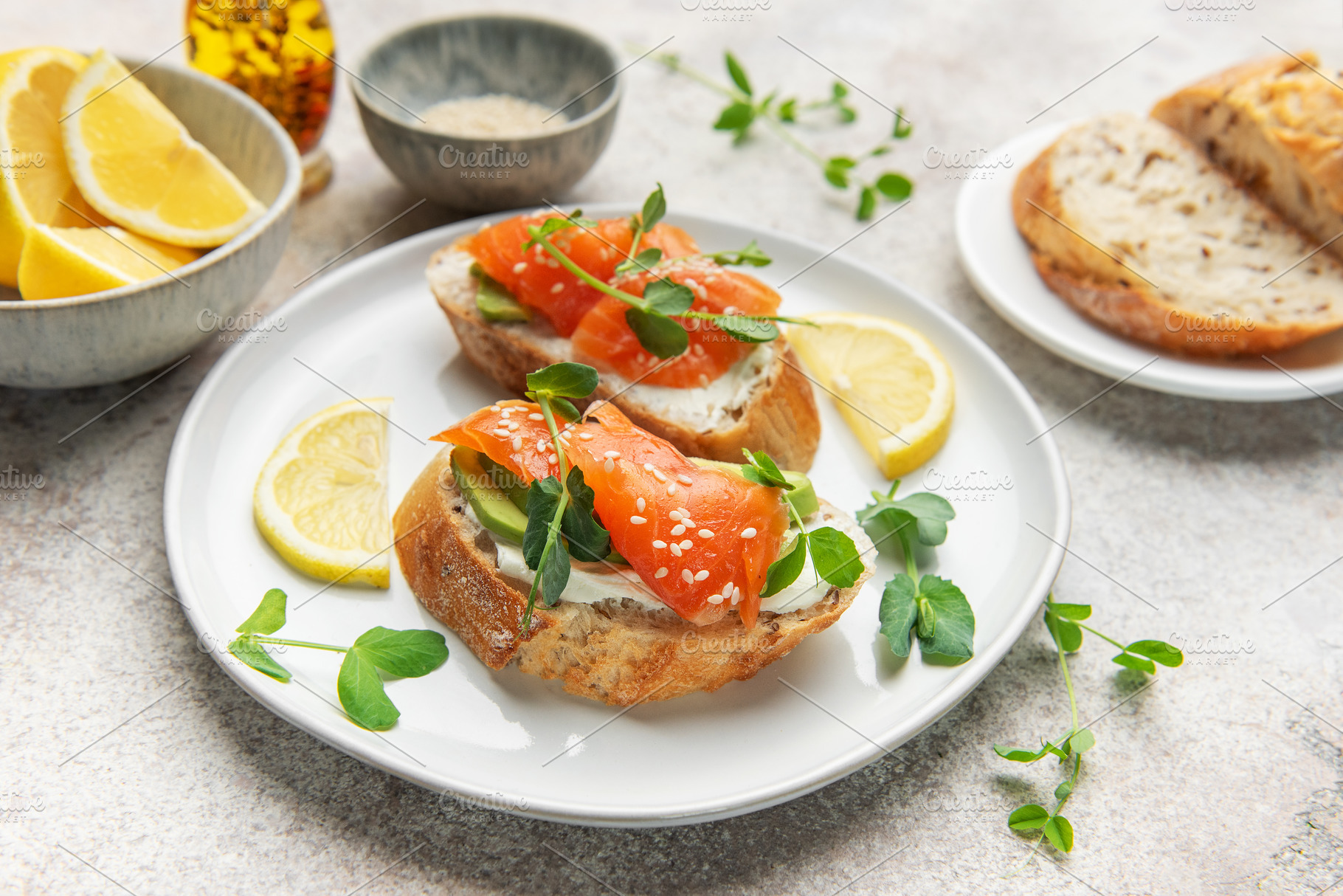 Salmon bruschetta with cream cheese and avocado slices, a Photo by Olena Rudo