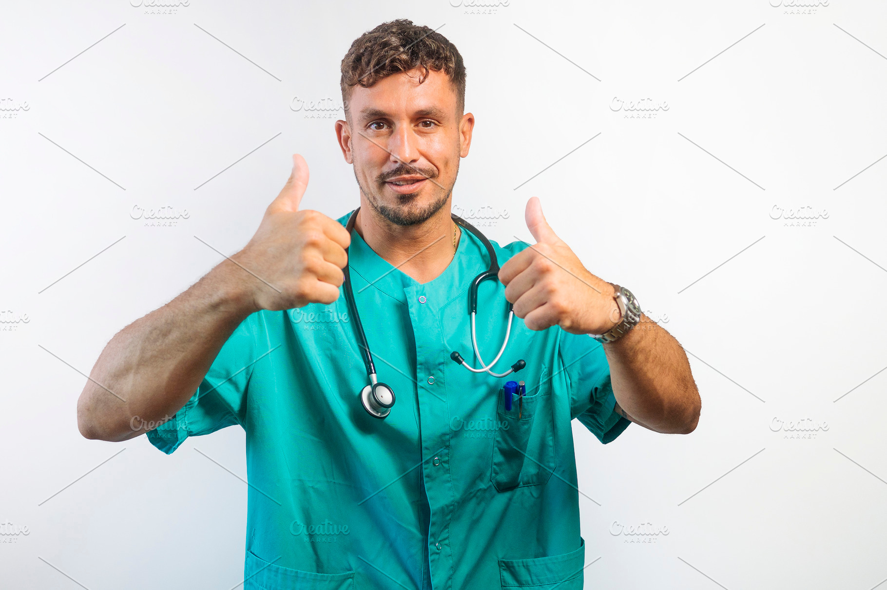 Smiling Doctor Giving Two Thumbs Up, a Person Photo by karrastock