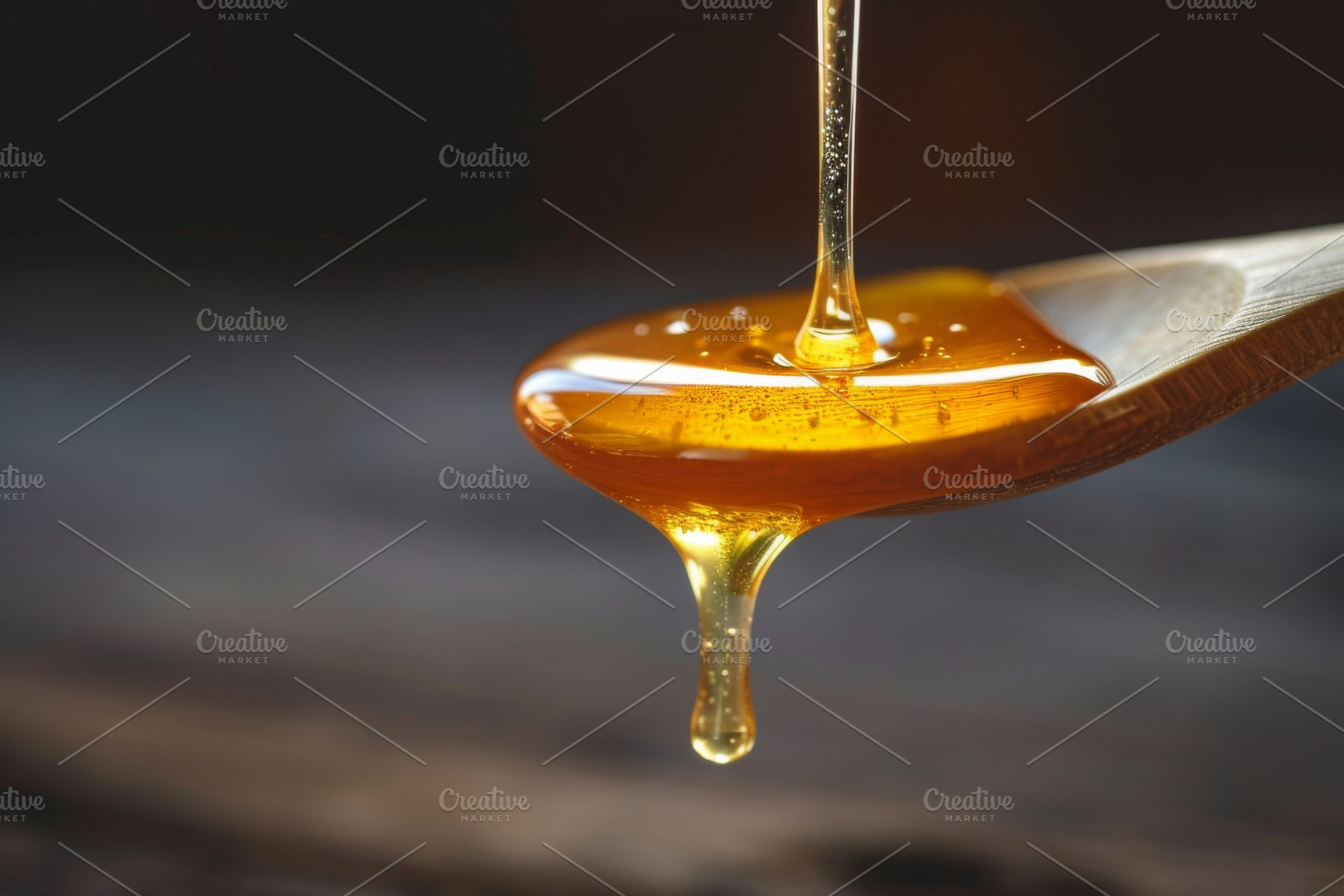 A silver spoon is shown with honey d, a Photo by Iftikhar Alam