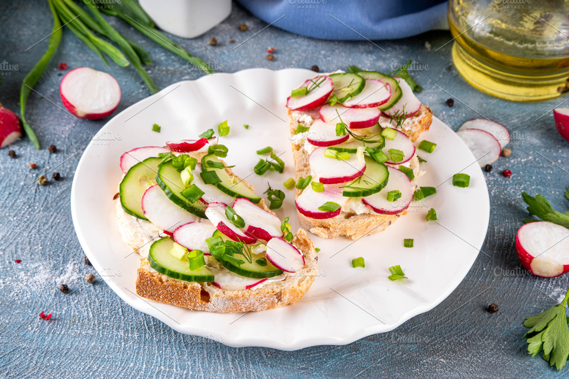Breakfast sandwiches with cream cheese, radishes, cucumber and f, a Food & Drink Photo by Rimma