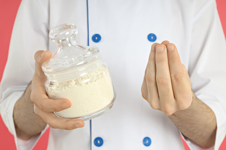 Concept of cooking with young man on pink background, a Person Photo by AtlasStudio PRO