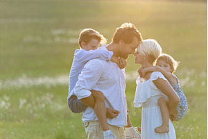 Young family with small children in, a Person Photo by HalfPoint