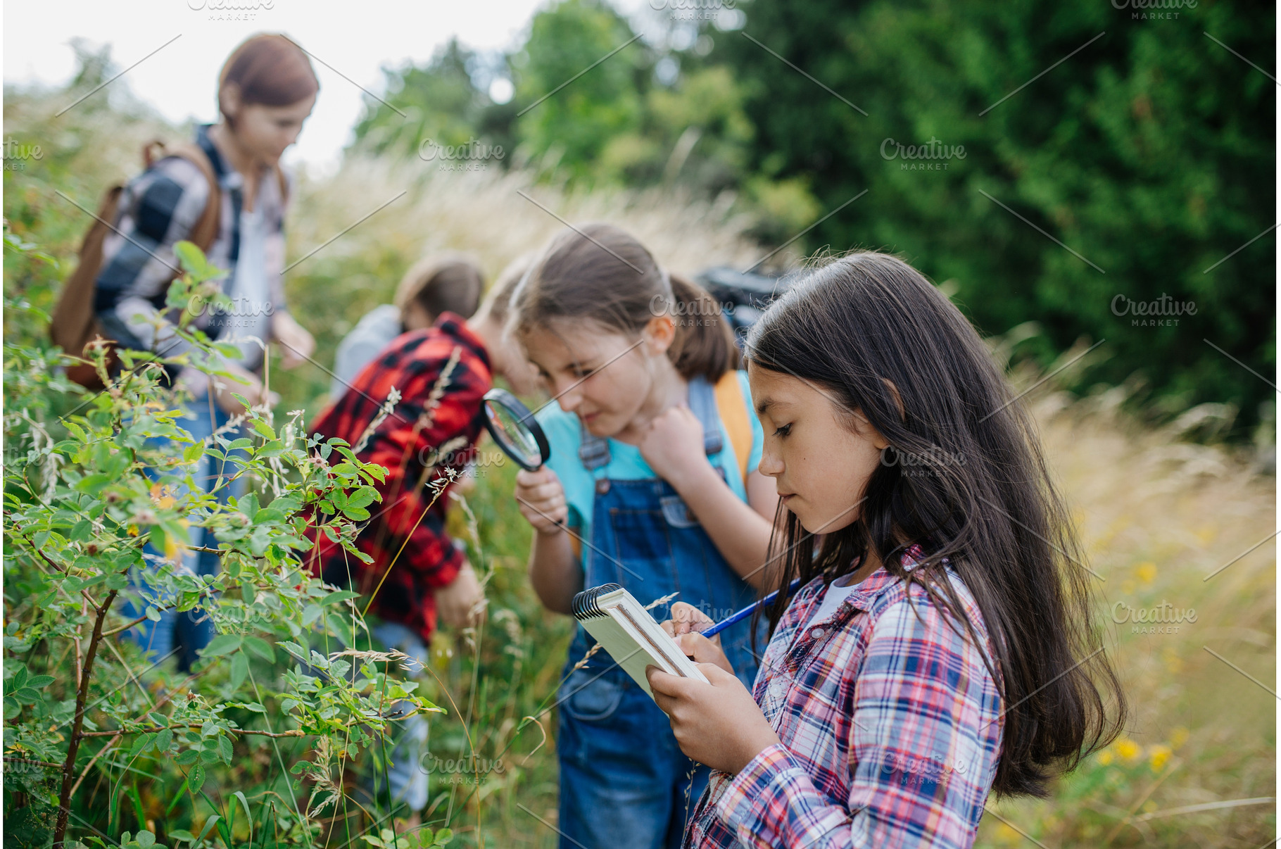 Young students learning about nature, a Person Photo by HalfPoint