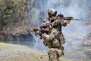Soldiers in camouflage military uni, a Person Photo by charnsitr