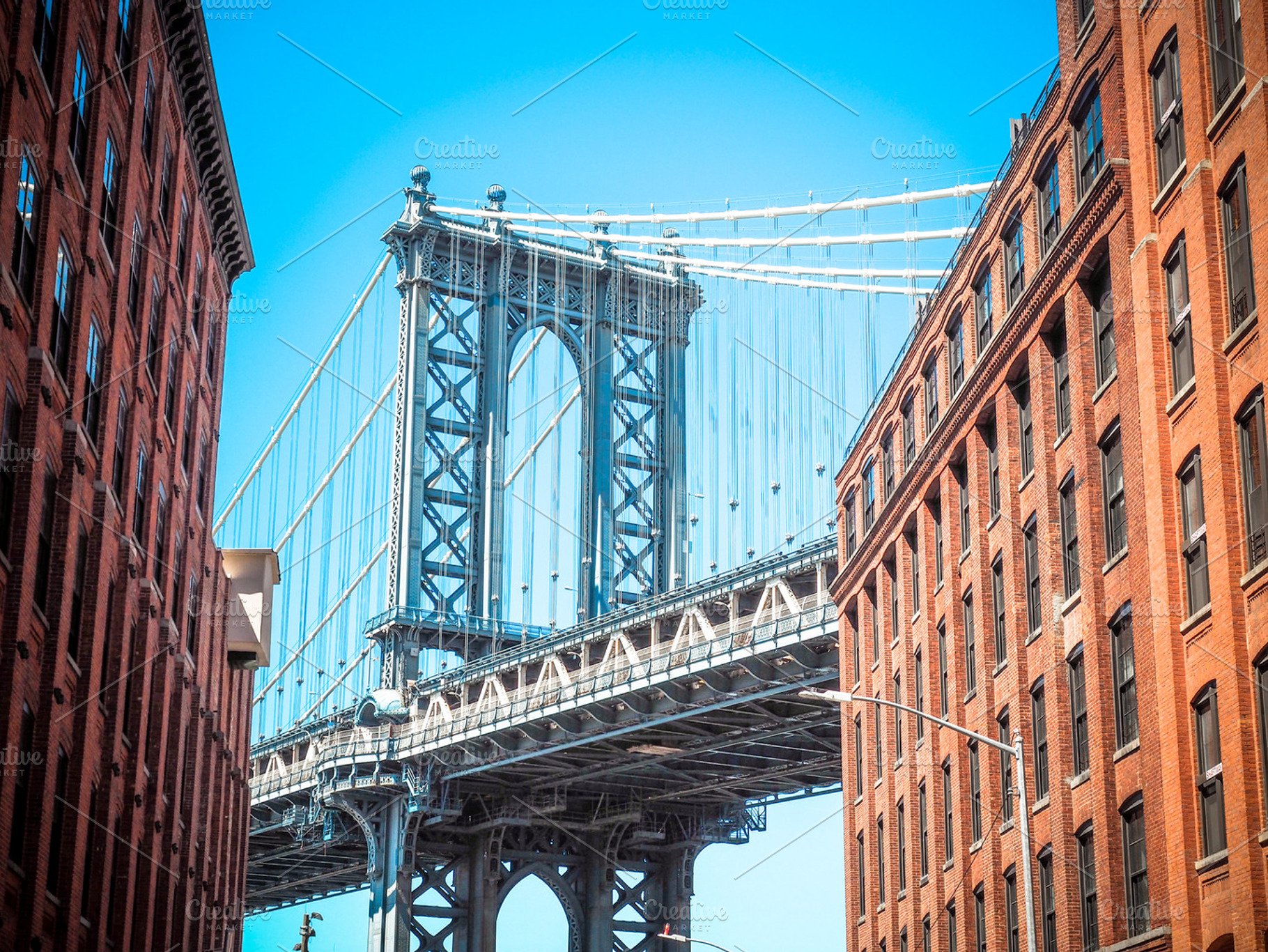 Manhattan bridge between buildings stock photo containing ny and nyc, an Architecture Photo by tydla