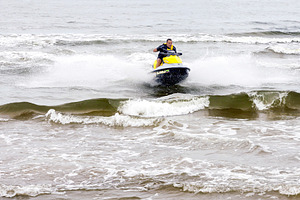 Man performing tricks on jet ski, a Sports & Recreation Photo by BOOCYS