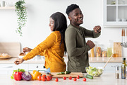 Joyful Black Spouses Having Fun In Kitchen While Cooking Lunch Together, a Photo by Prostock-Studio (Thumbnail 3 of 3)