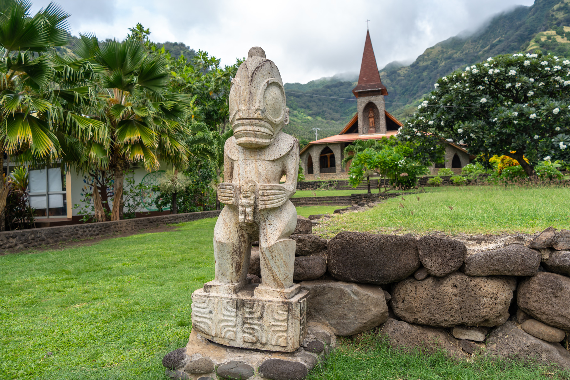 Tiki statue in front of the Vaitahu church, Tahuata, Marquesas I, a ...