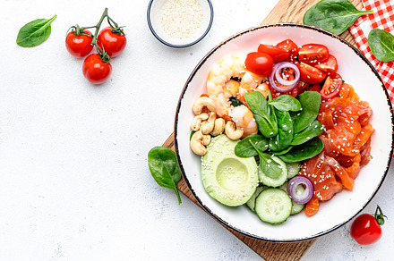 Keto salad with spinach, salmon, shrimp, avocado, cucumber, toma, a Food & Drink Photo by 5PH