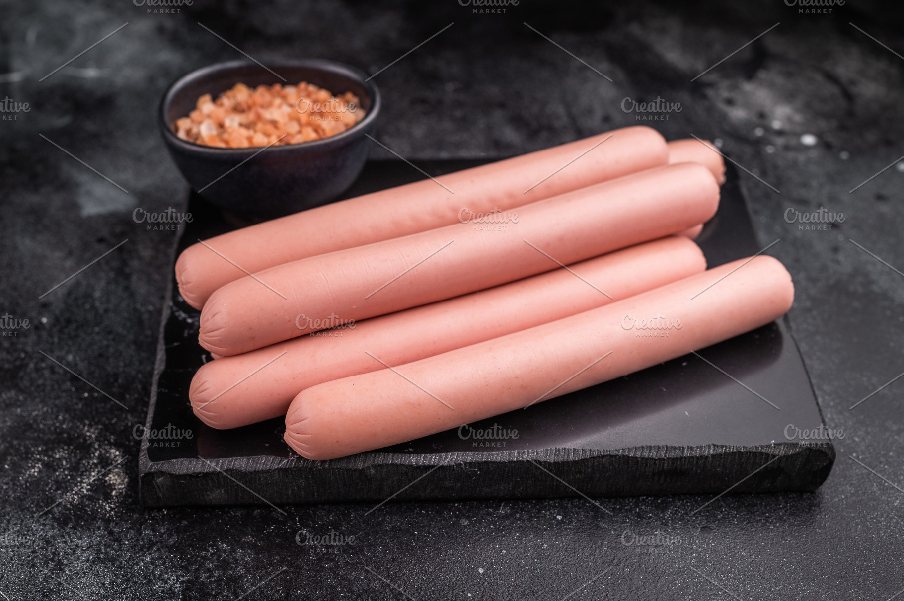 Four raw pink hot dog sausages (frankfurters/wieners) on a contr, a Food & Drink Photo by composter-box@mail.ru