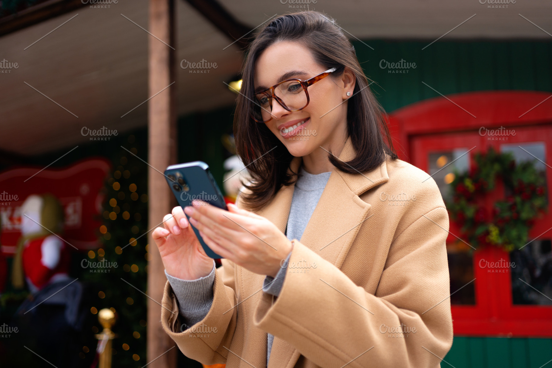 Woman in glasses using mobile phone at day in the city, a Person Photo by andreonegin market