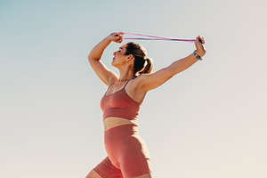 Woman in sportswear doing pilates to increase physical strength and mental well, a Person Photo by Jacob Lund
