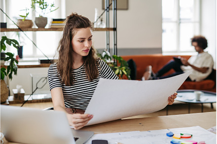 Young woman working in startup, a Person Photo by HalfPoint