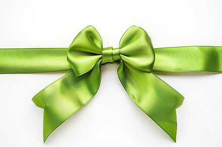 Green satin ribbon bow on white background, a Beauty & Fashion Photo by AlyaAnd