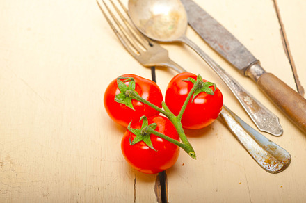 ripe cherry tomatoes over white wood, a Food & Drink Photo by keko64
