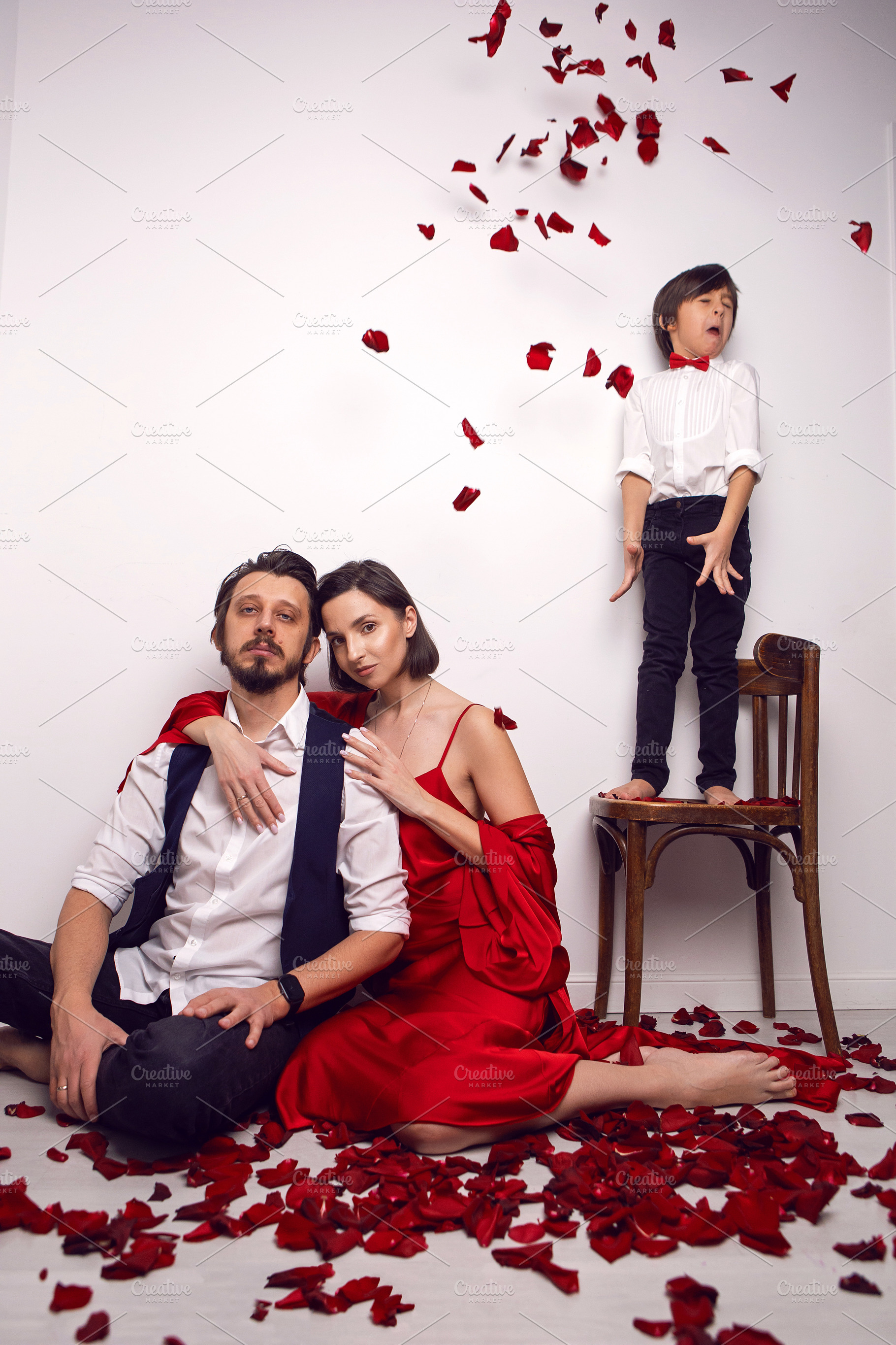 couple of lovers are sitting on the floor in an apartment against a white wall, a Person Photo by SaulichPhoto