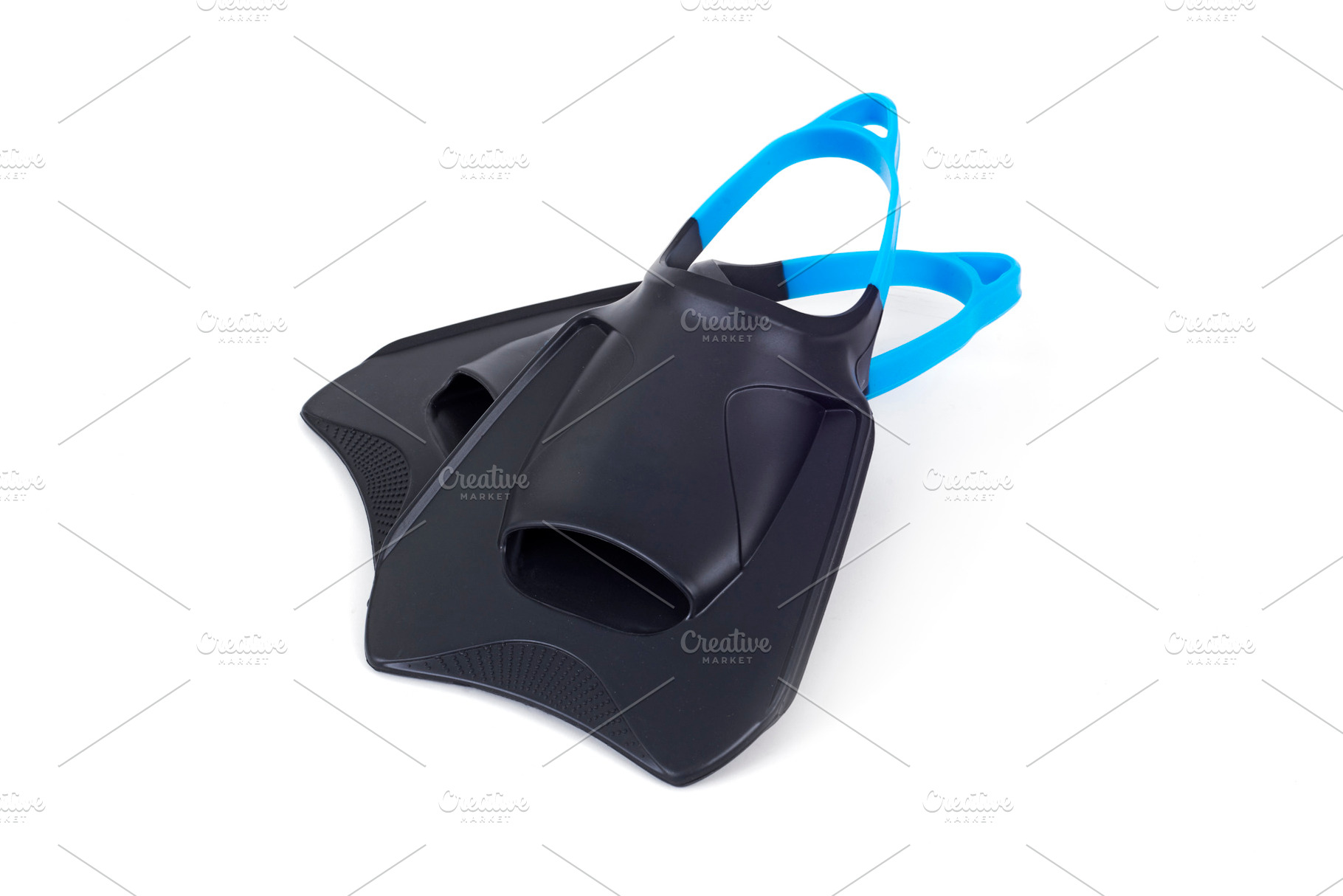 black swimming fins with blue straps, a Photo by Nito