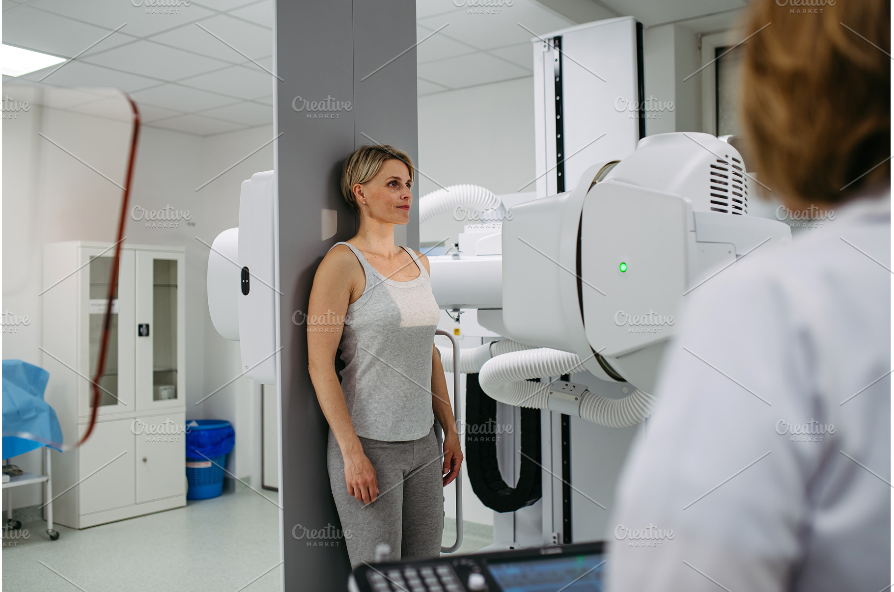 Female patient undergoing dynamic X, a Health & Medical Photo by HalfPoint