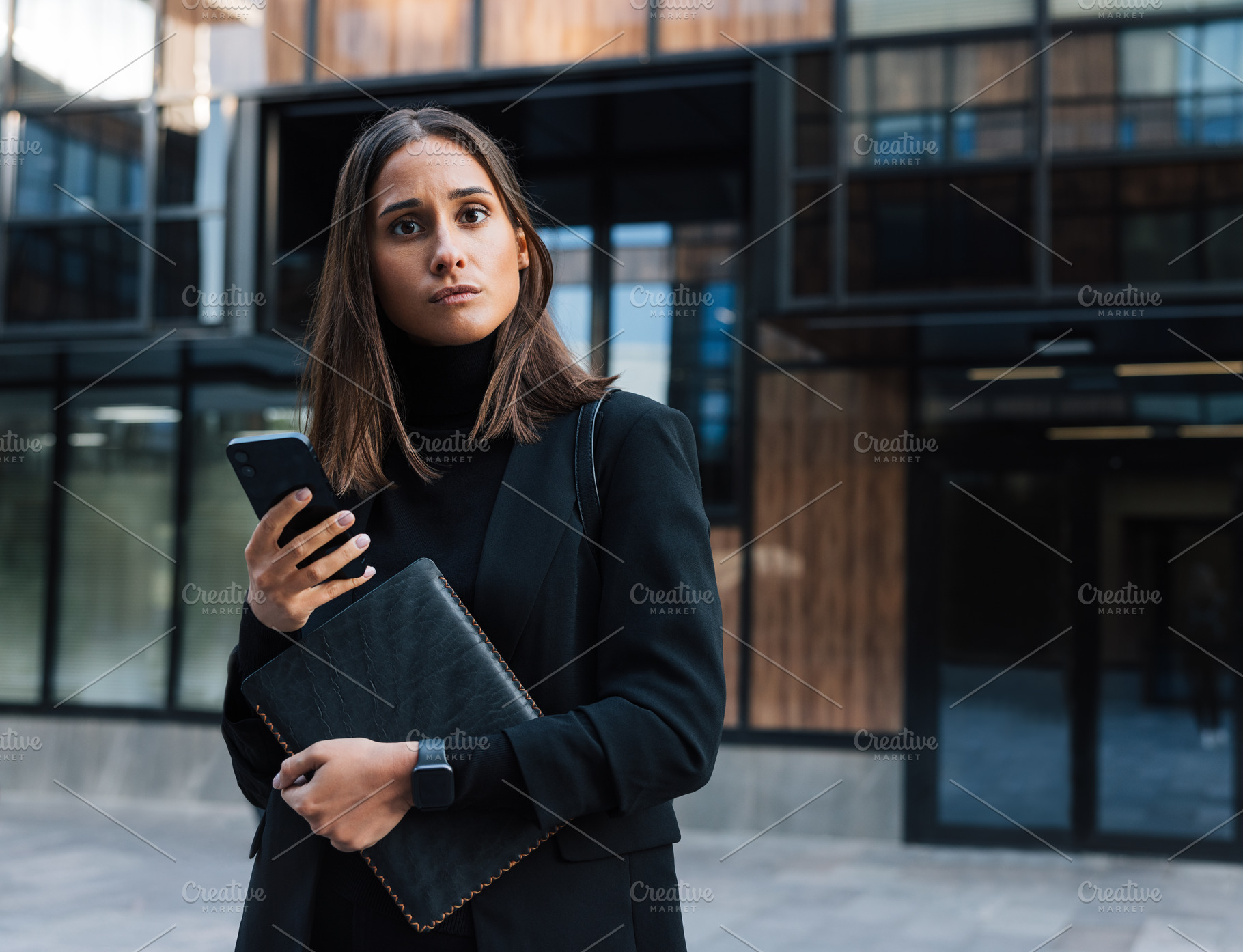 Young businesswoman in black formal, a Business Photo by Artem Varnitsin