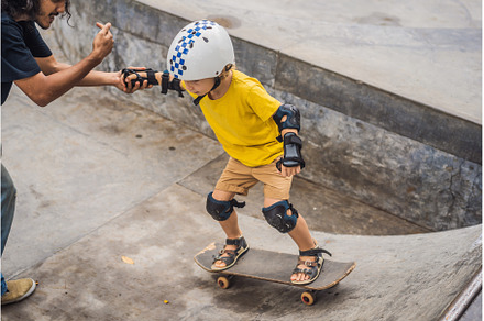 Athletic boy learns to skateboard, a Sports & Recreation Photo by Elizaveta Galitskaya