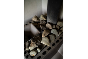 Vertical shot of sauna stones in, a Health & Medical Photo by volodymyrshtun13795