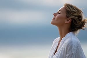 Peaceful woman breathing fresh air, a Person Photo by MistyDay