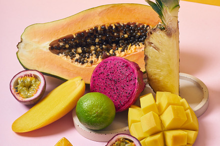 Tropical fruits variety on a colorful background. Side view with