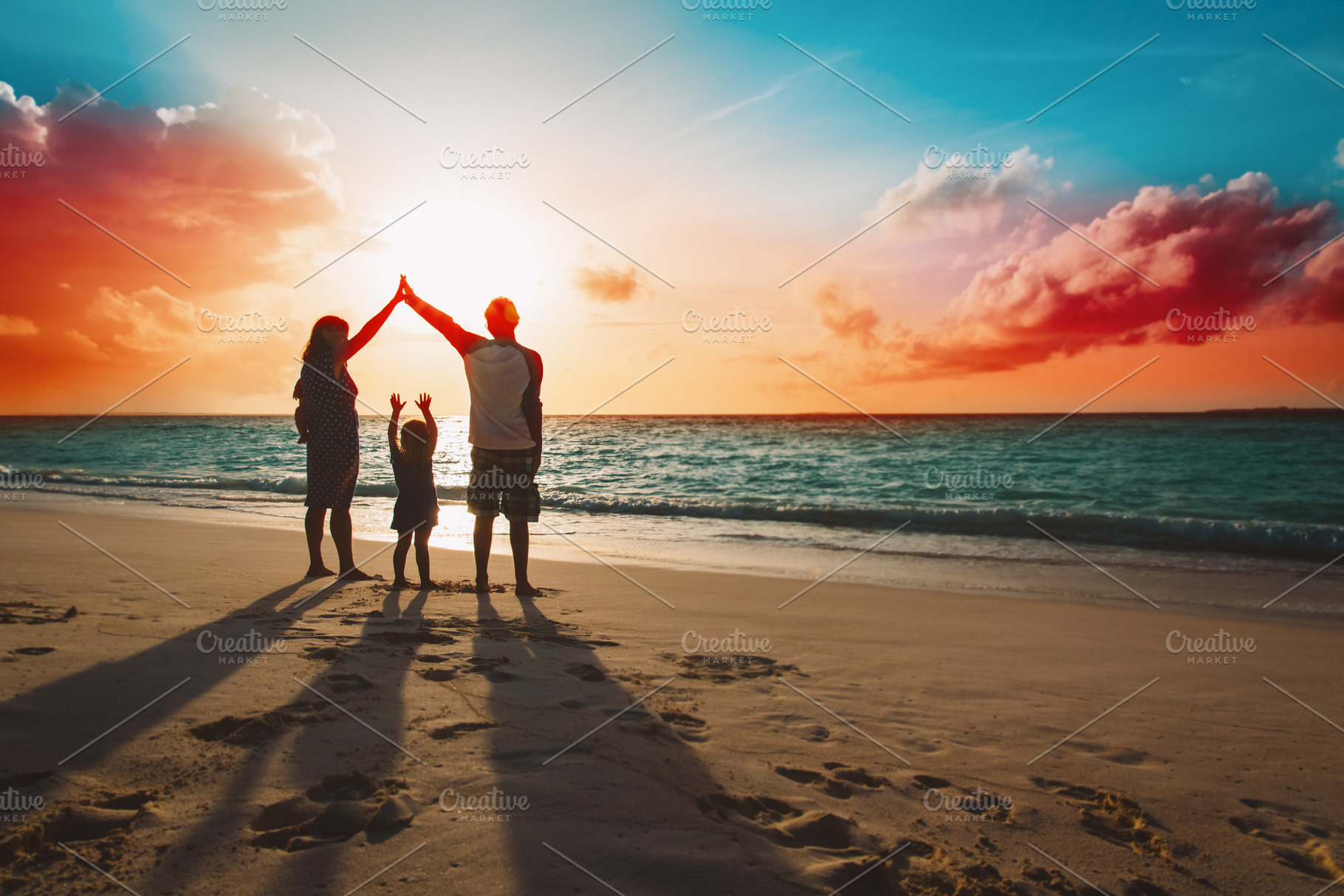 Happy family on sunset beach stock photo containing baby and beach, a Person Photo by Nadezhda_Prokudina