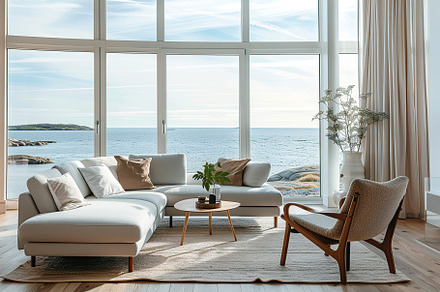 Modern living room with couch overlooking on ocean. Scandinavian interior, a Beauty & Fashion Photo by AlyaAnd