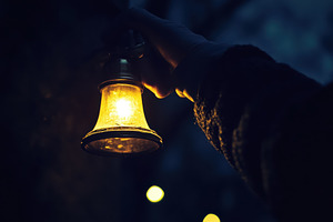 Ringing a bell in the dark while hol, a Photo by Iftikhar Alam