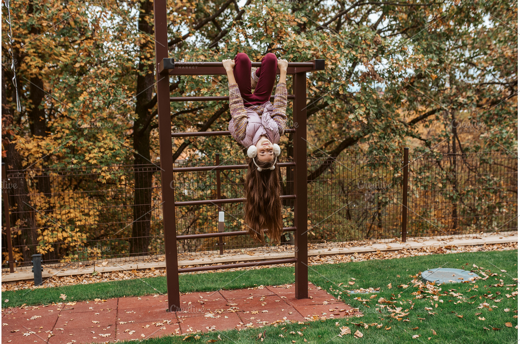 Girl hanging upside down on, a Nature Photo by HalfPoint