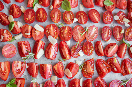 Fresh tomato slices with herbs, a Food & Drink Photo by Olena Rudo