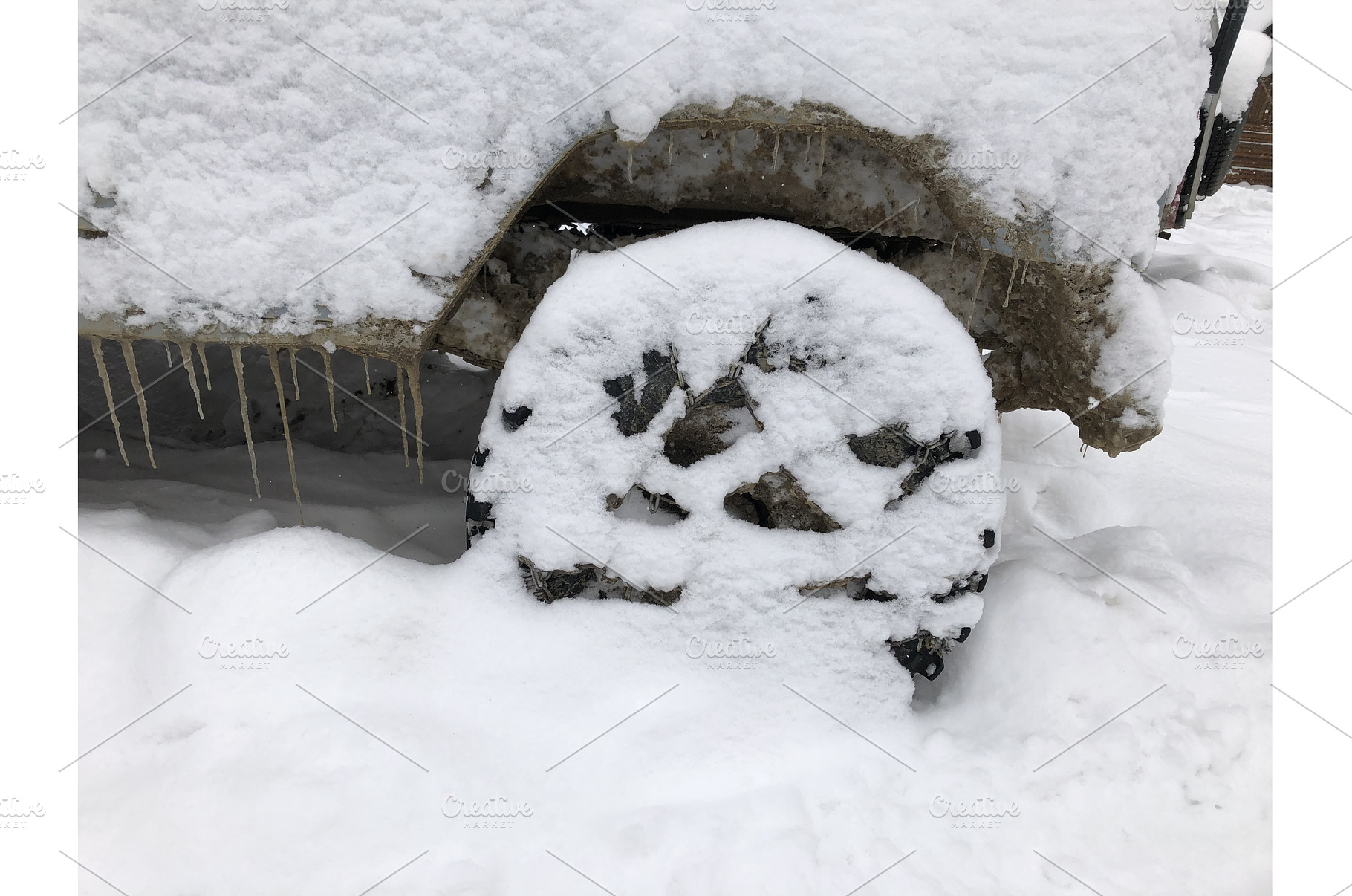 Rear wheel of a snow covered off, a Transportation Photo by Oleksandr Berezko