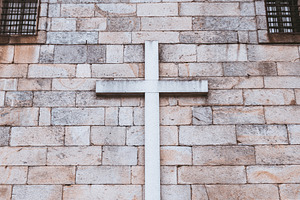 Cross on old stone wall, minimalism, an Architecture Photo by SkyNext