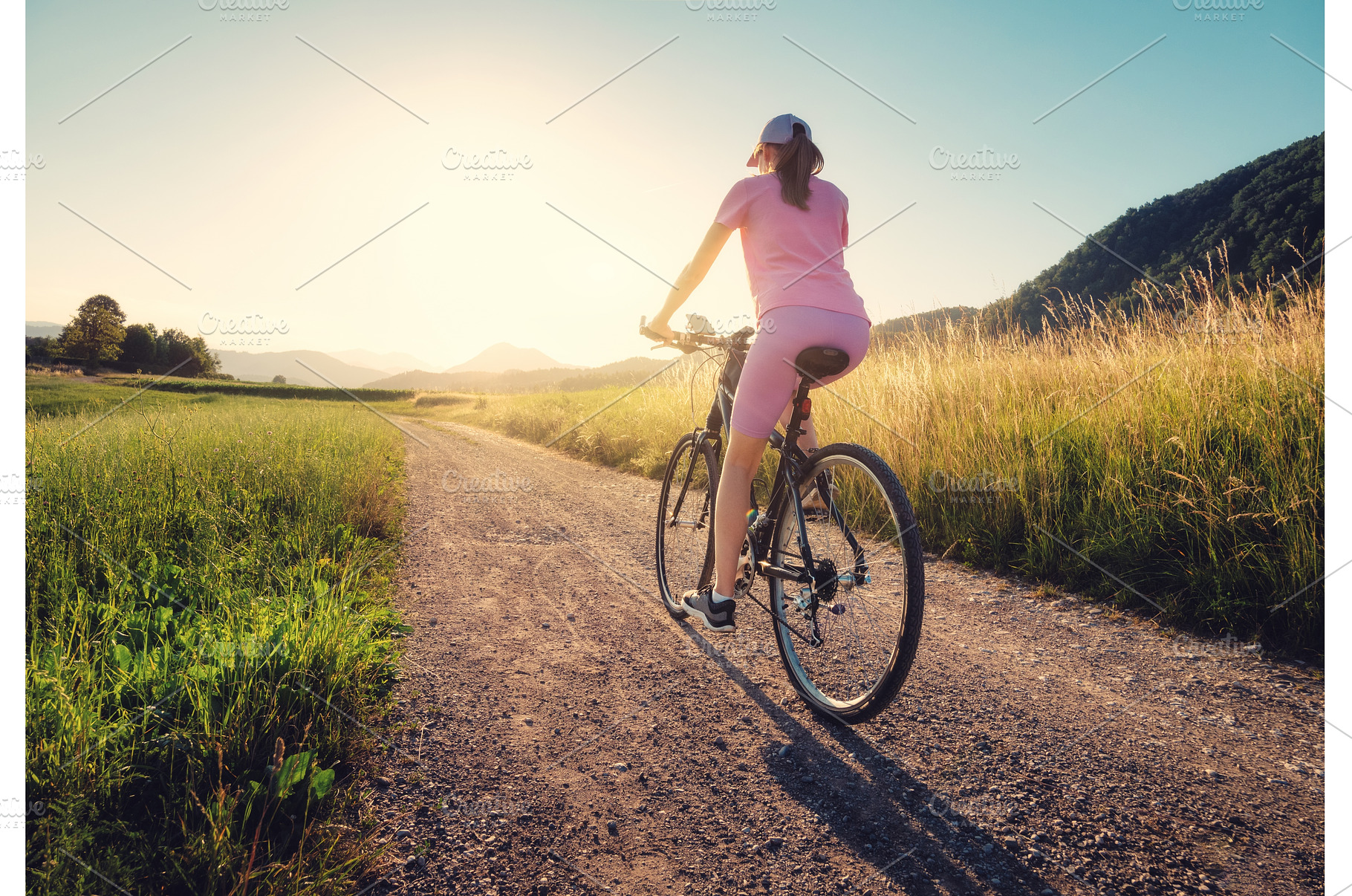 Woman is riding a mountain bike on, a Sports & Recreation Photo by den-belitsky