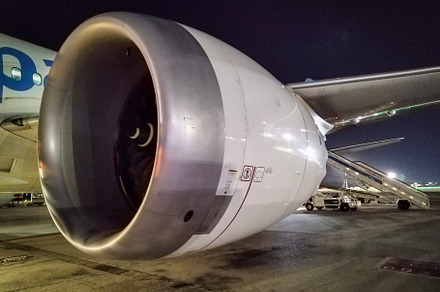 Airplane turbine at night seen from runway close-up, a Transportation Photo by DanFLCreativo