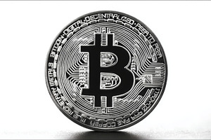 Close-up of a silver Bitcoin cryptocurrency coin on white background representi, a Photo by AS photostudio