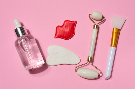 Bottle with transparent serum, red decorative lips, white gua sh