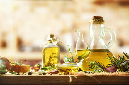 Containers with cooking oil with rosemary extract in kitchen, a Food & Drink Photo by Davizro's Market