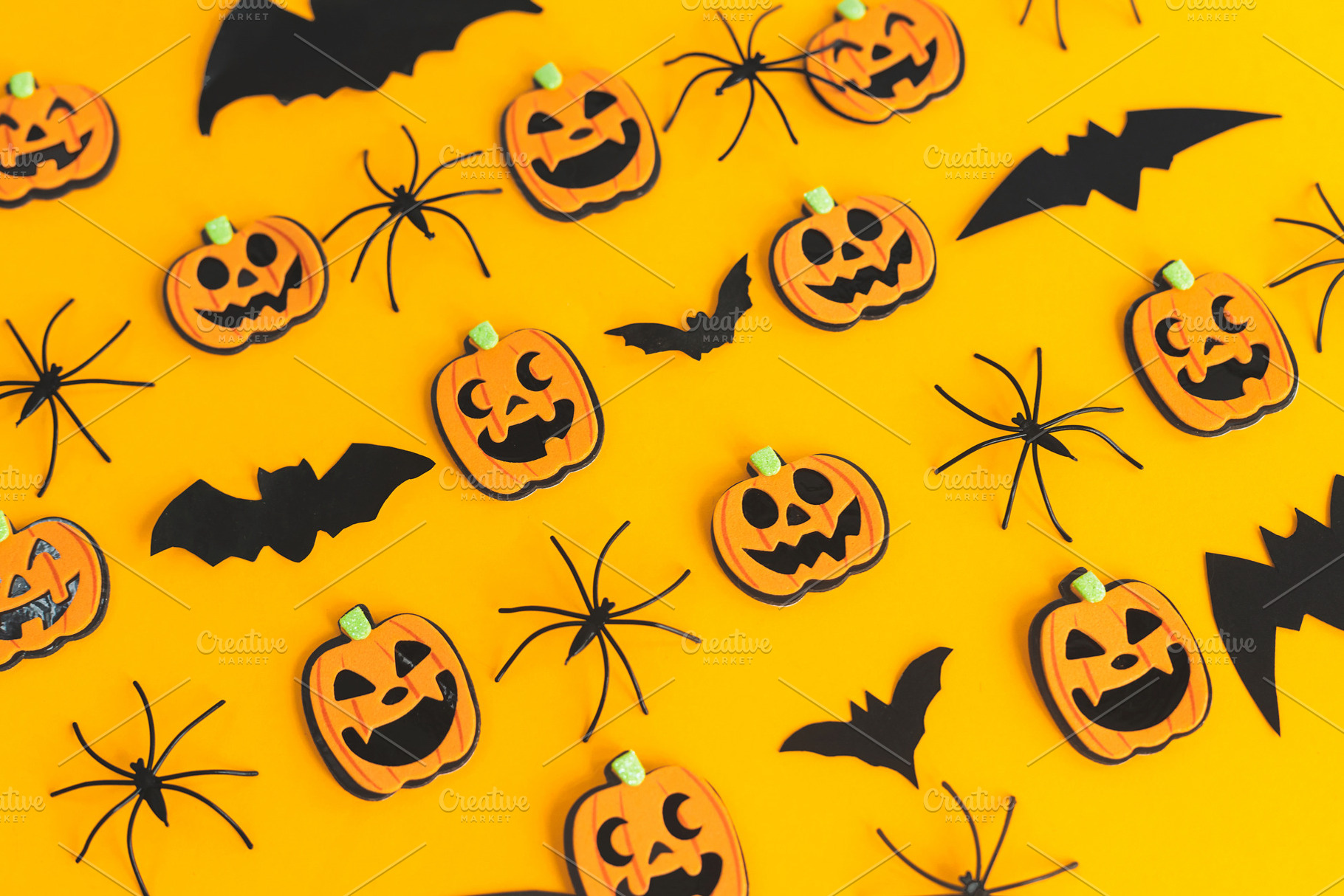 Happy Halloween. Pumpkins, spiders, bats flat lay on orange back, a Holiday Photo by Sonjachni