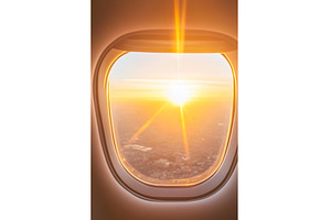 Golden sunrise view through airplane, a Nature Photo by Lermont51