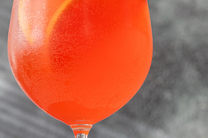 Vibrant Campari Spritz cocktail with citrus ice bubbles elegant, a Food & Drink Photo by Alexander Prokopenko