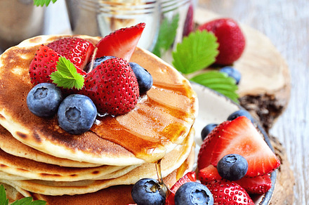 Stack of pancakes with fresh berries featuring syrup, honey, and stacked, a School & Education Photo by RosyMaple
