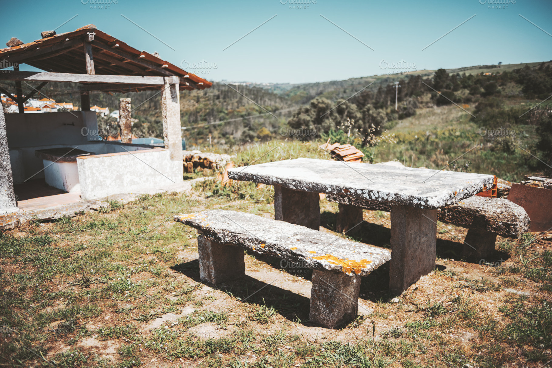 Rustic stone table in countryside, a Photo by SkyNext