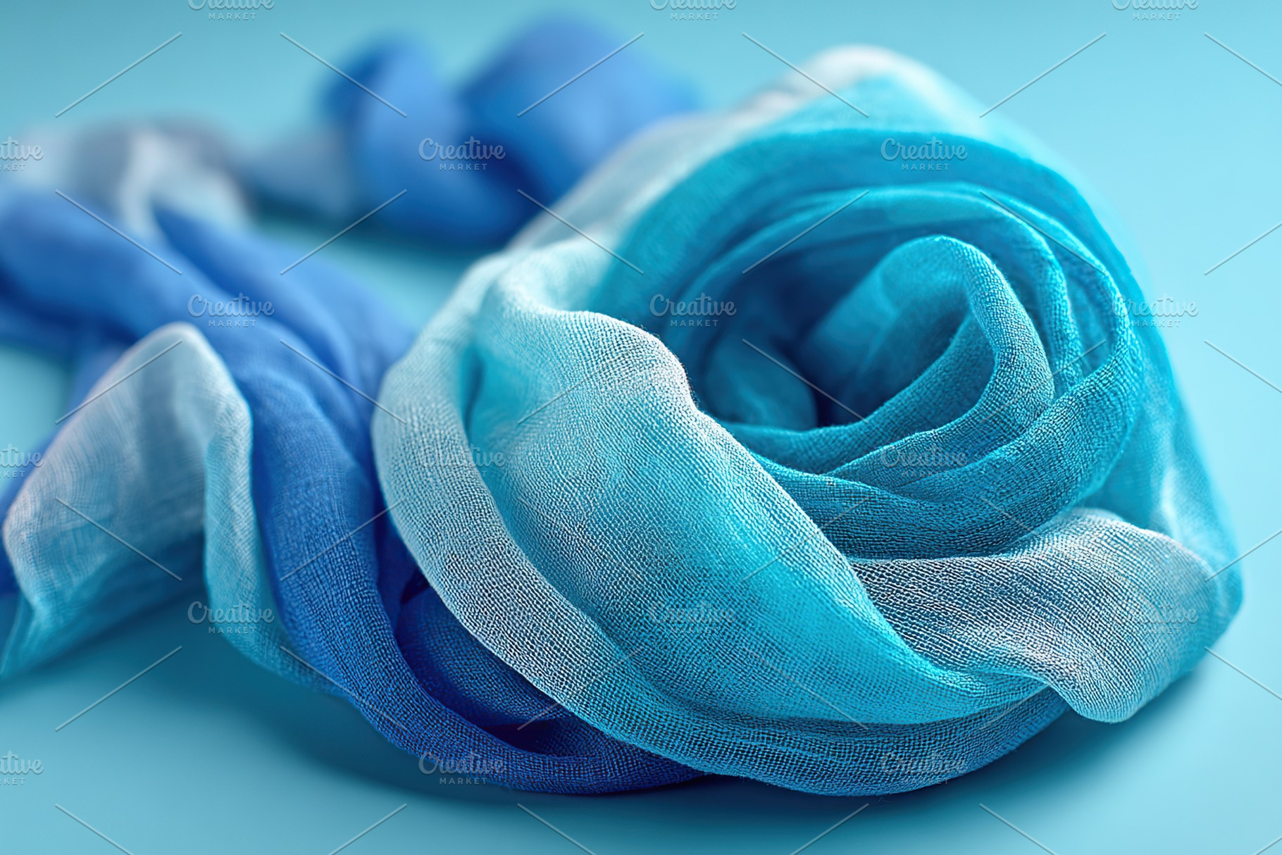 Soft light blue scarf elegantly displayed against a subtle turquoise backdrop, a Background Photo by AlyaAnd